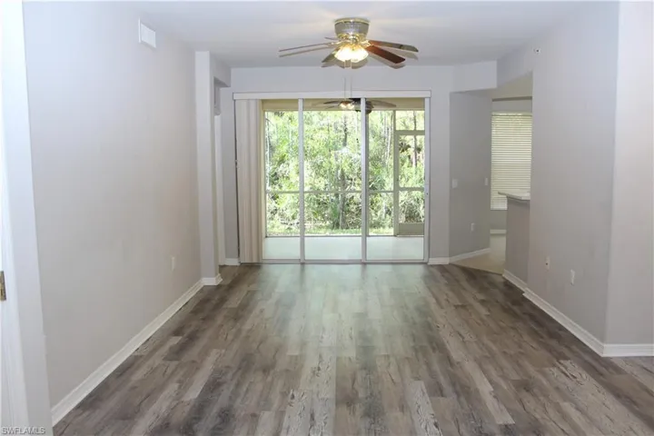 Spare room with ceiling fan and dark hardwood / wood-style flooring