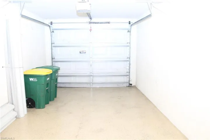 Garage featuring a garage door opener