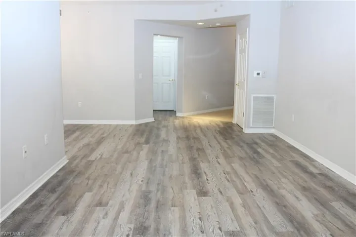Spare room featuring hardwood / wood-style flooring
