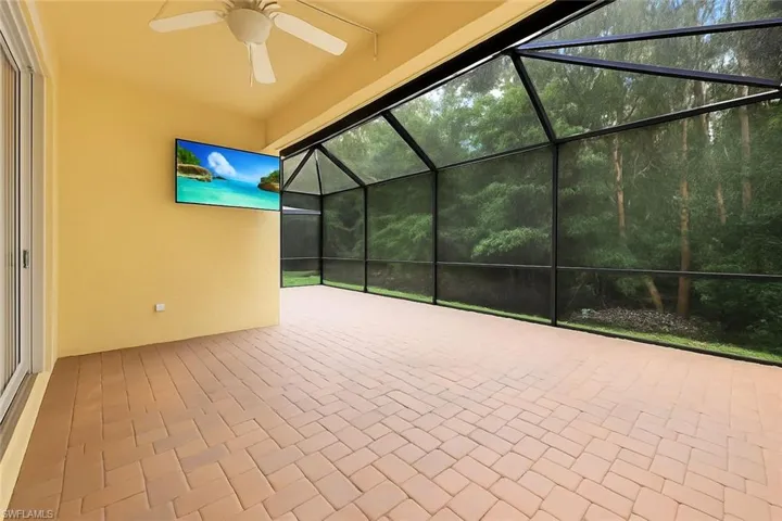 View of patio / terrace with a sunroom, a lanai, and ceiling fan