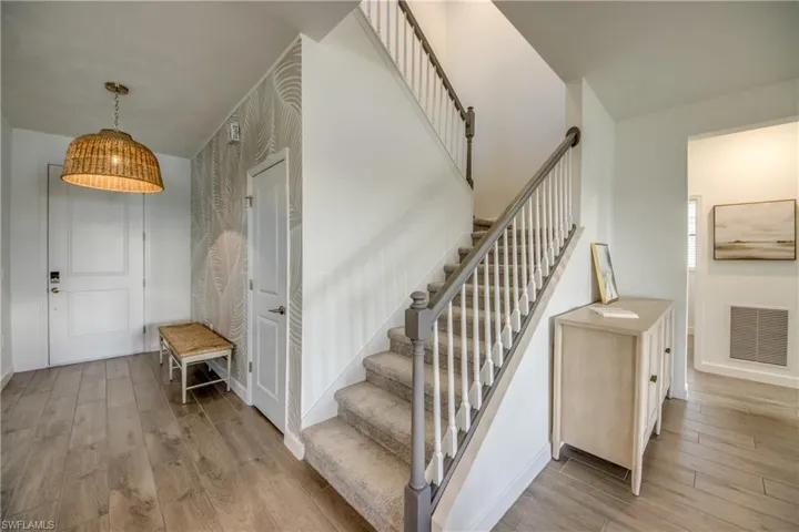 Staircase with wood finished floors