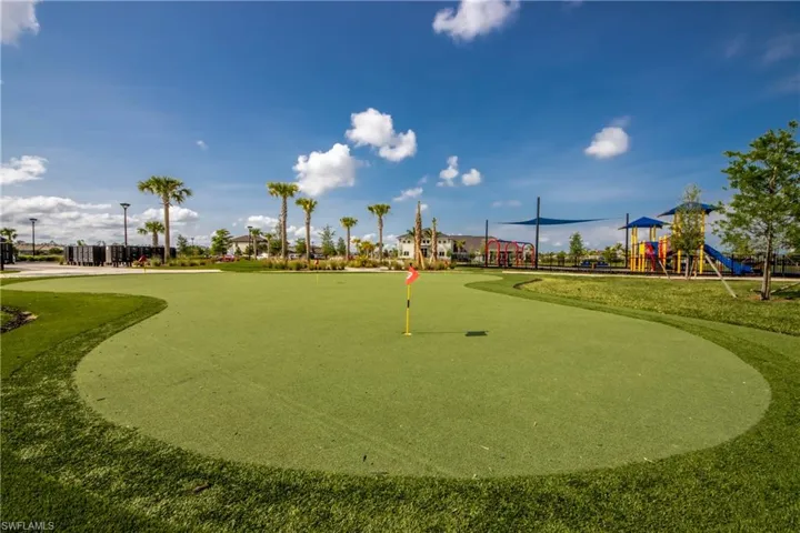 View of home's community with a putting green