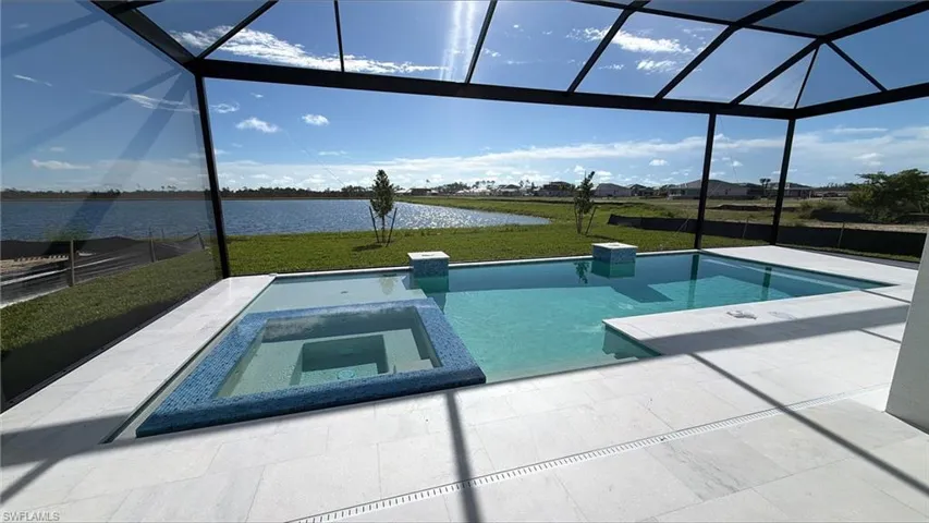 Beautiful pool and spa with full screen enclosure