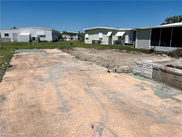 South Side of lot with carport area.