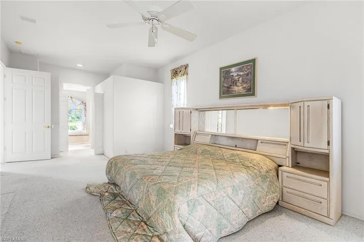 Bedroom with recessed lighting and ensuite bathroom