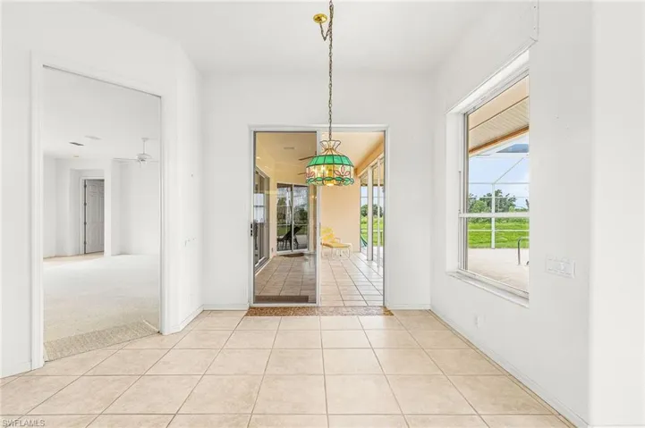 Unfurnished dining area featuring light tile patterned floors