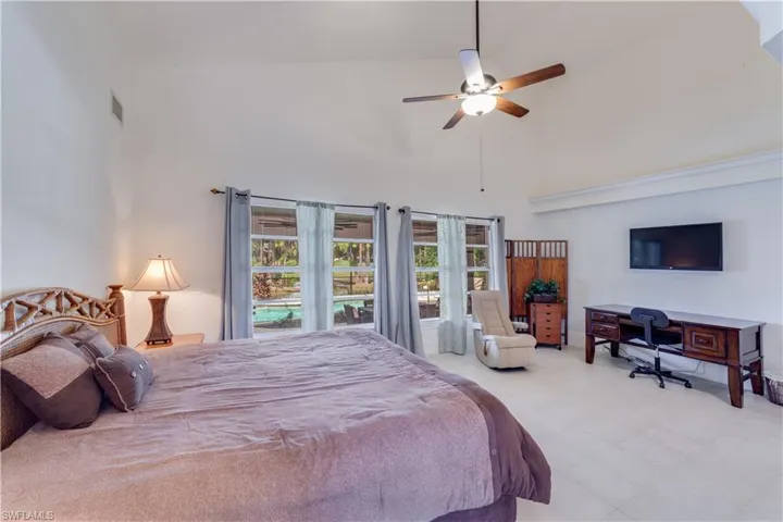 Master Bedroom featuring ceiling fan and high vaulted ceiling