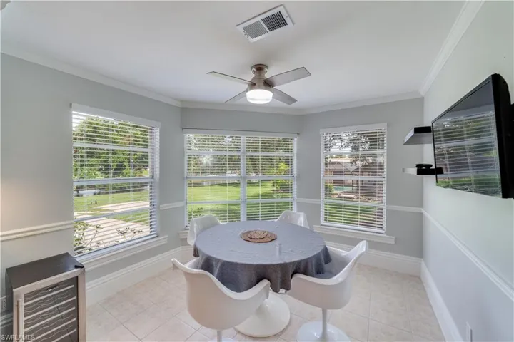 Breakfast room,  Light & Bright, with ornamental molding, ceiling fan, light tile patterned floors,