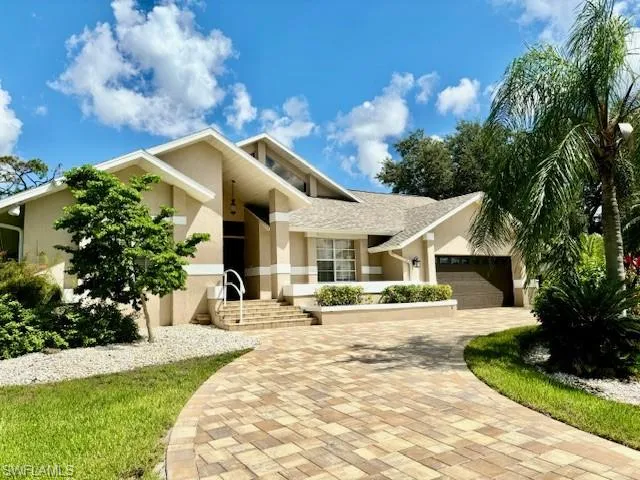 View of front of property with a garage