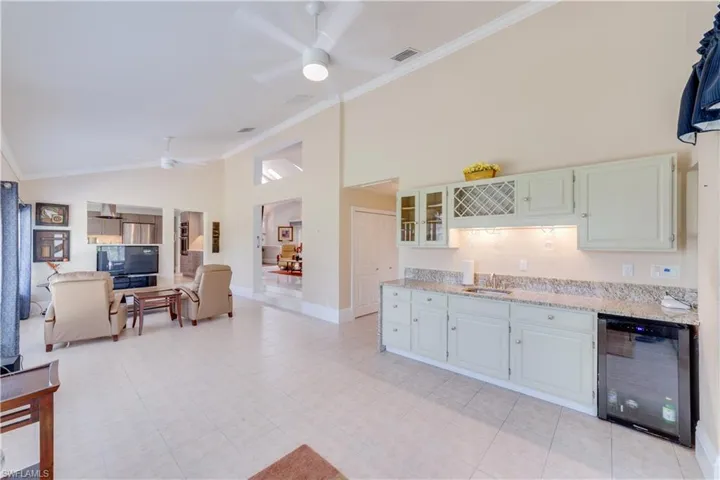 ceiling fans, Wet bar, beverage cooler, crown molding. Great for entertaining.