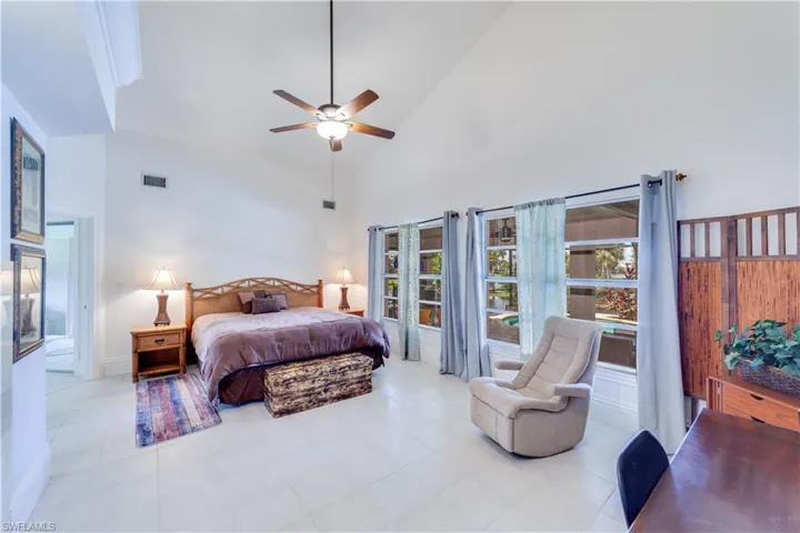 Master Bedroom featuring ceiling fan and high vaulted ceiling