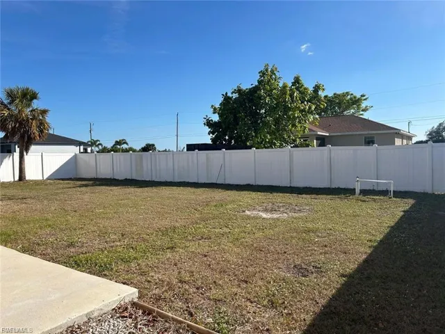 View of fenced backyard