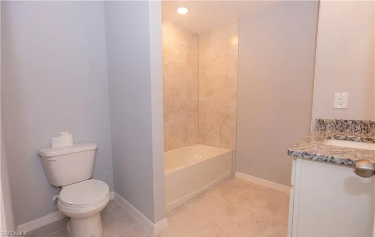 Bathroom with vanity and light tile patterned flooring