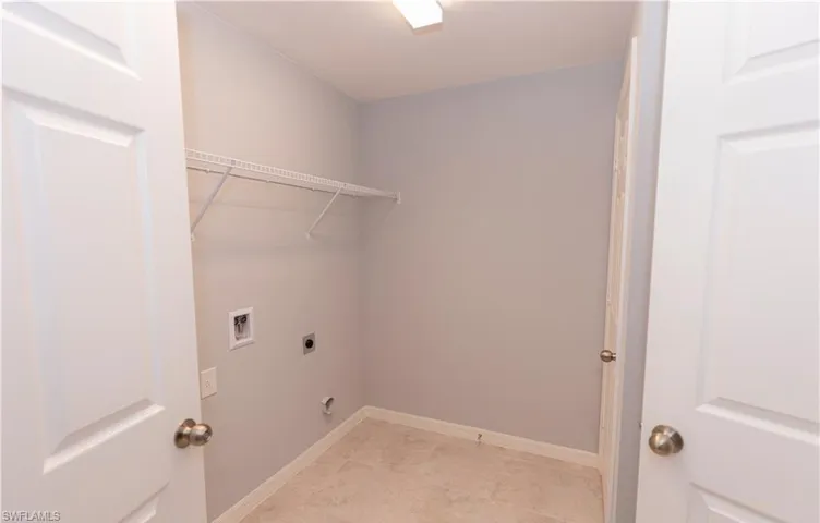 Laundry room featuring washer hookup and hookup for an electric dryer