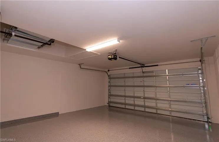 Garage featuring a garage door opener