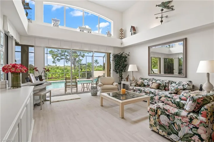 You will love to entertain in this open and airy living room. VAULTED CEILINGS THROUGHOUT THE HOME!