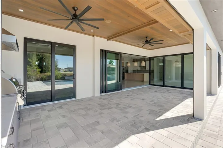Spare room with a raised ceiling, recessed lighting, light wood-style floors, and a ceiling fan