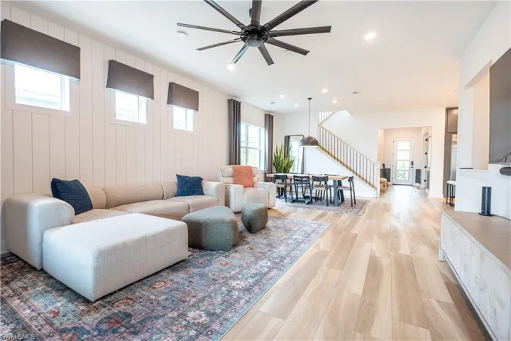 Open-concept living area featuring light wood-finish flooring throughout