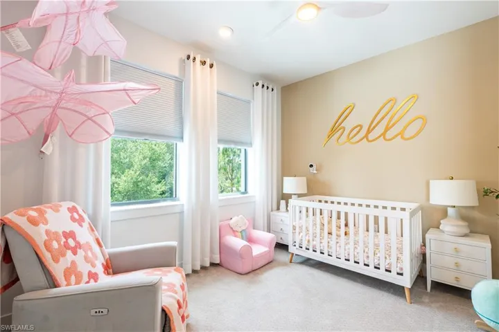 Room featuring neutral wall tones and soft carpeting