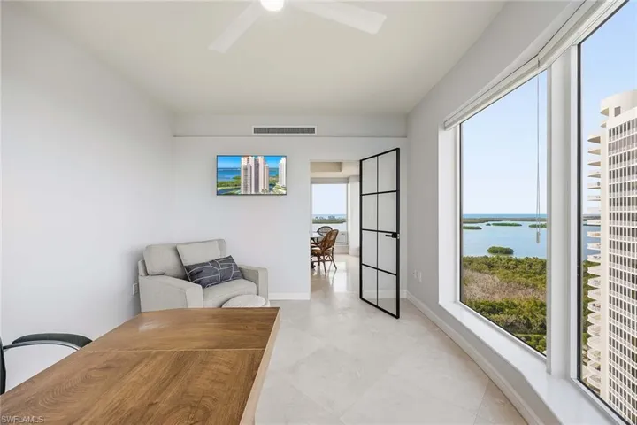 Sitting room with a water view and baseboards