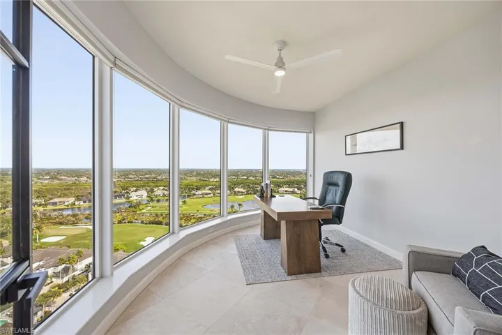 Office with a residential view, a water view, golf course view, and ceiling fan