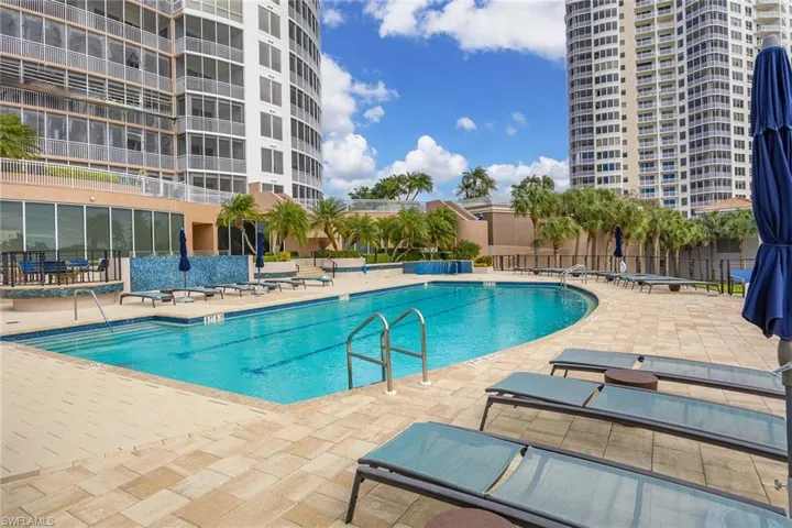 Community pool with a patio