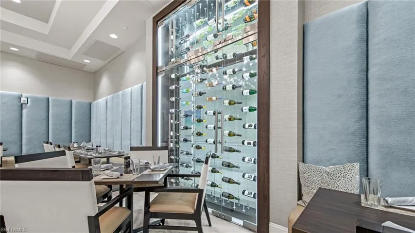 Restaurant with seating and picturesque wine wall