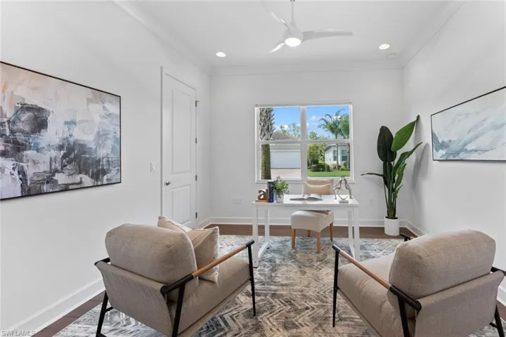 Office area with ceiling fan, hardwood  and crown molding