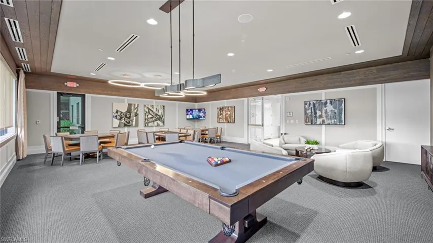 Rec room with carpet floors and billiards