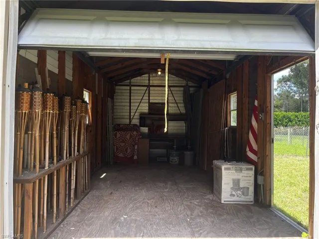 View of detached single car garage/workshop with electricity.