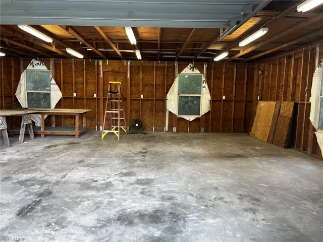 View of detaached garage/workshop with electricity.