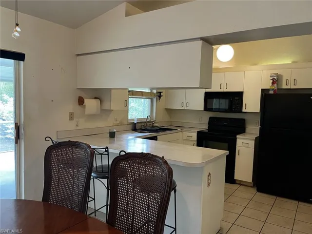 Kitchen featuring a kitchen breakfast bar.