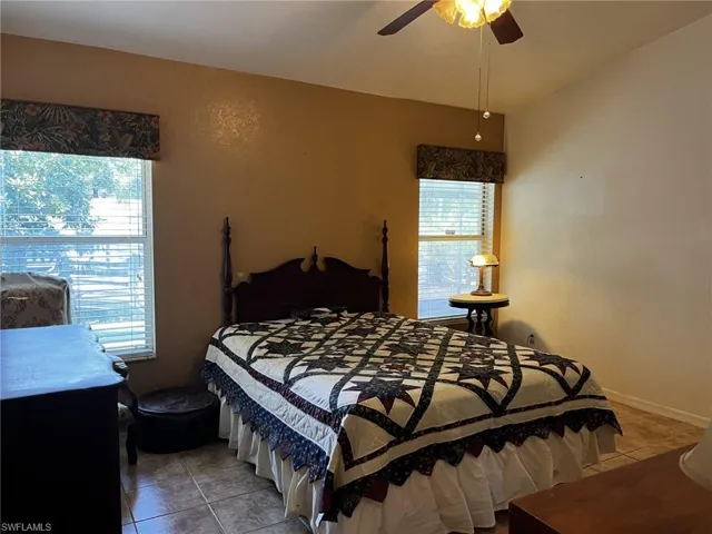 Master Bedroom with  light tile patterned flooring