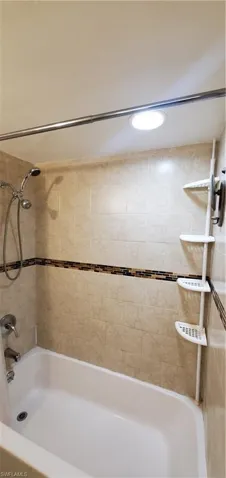 Bathroom featuring tiled shower / bath
