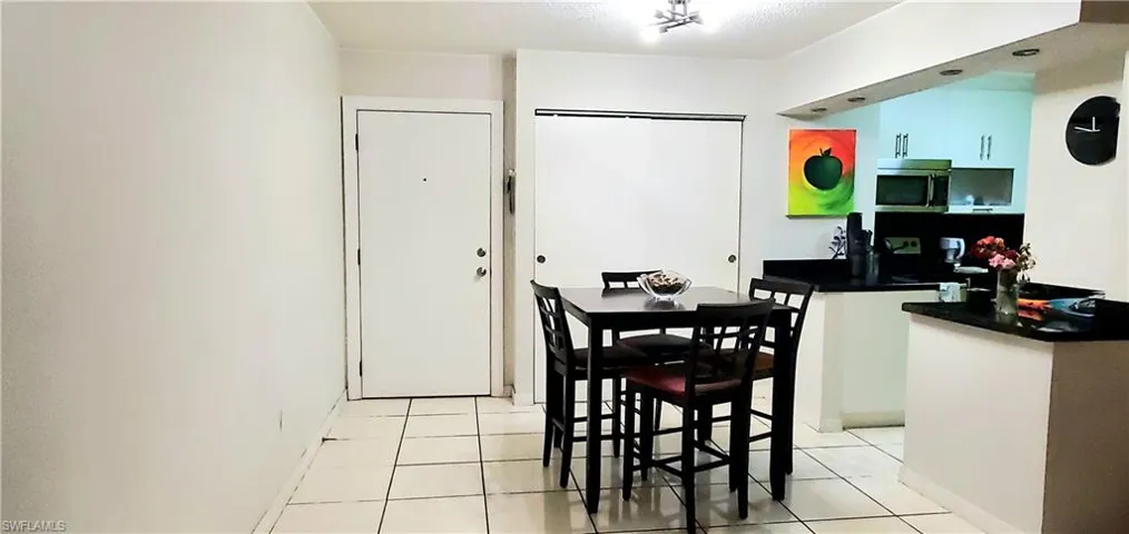 Dining room with light tile patterned floors