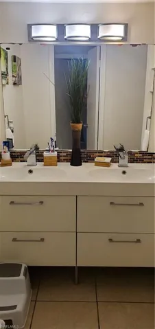 Bathroom with vanity and tile patterned floors