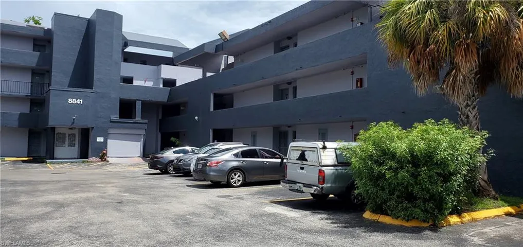View of vehicle parking with a garage