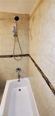 Bathroom featuring plus walk in shower