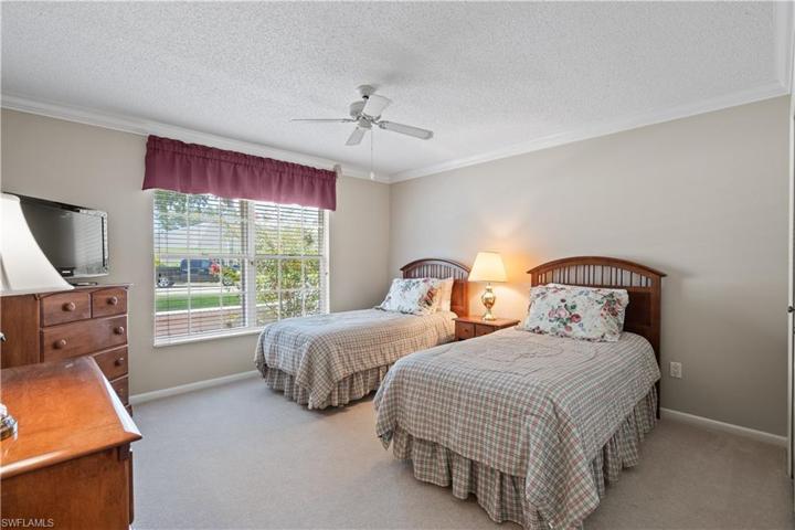 Guest bedroom. Window has roll down storm shutter.