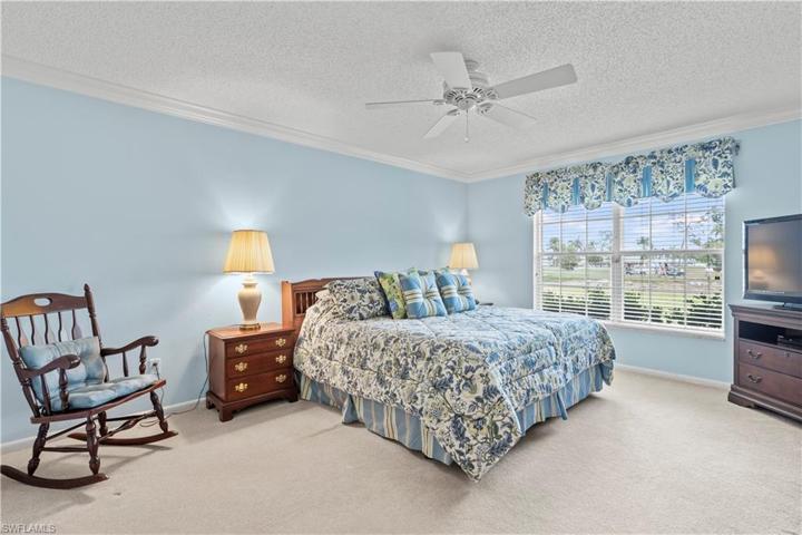 Primary bedroom. Window has roll down storm shutter.