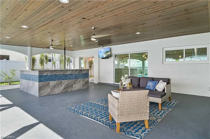 View of patio featuring an outdoor living space and a ceiling fan
