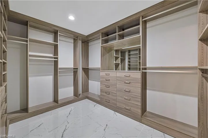 Spacious closet with marble finish flooring