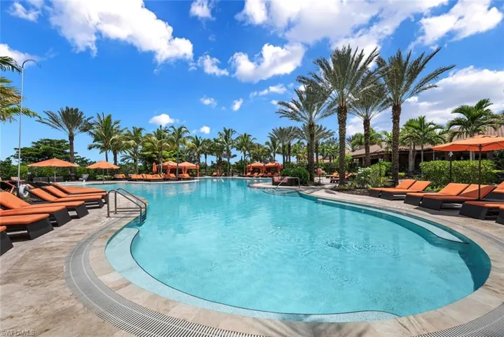 Community pool with a patio