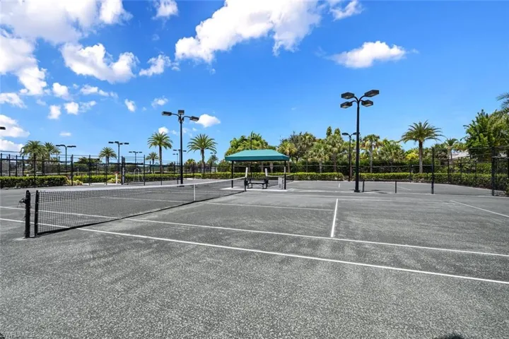 View of sport court featuring fence
