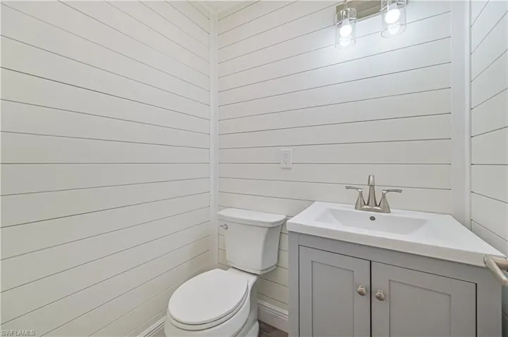 1/2 Bath with new vanity ,shiplap walls