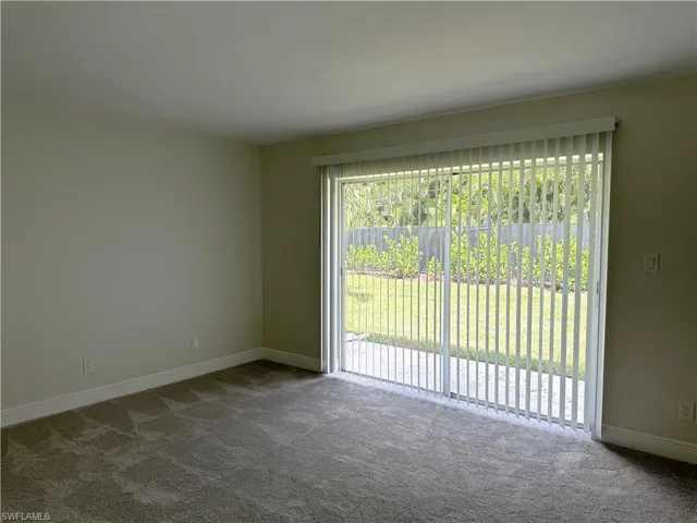 View of carpeted master bedroom with new window blinds