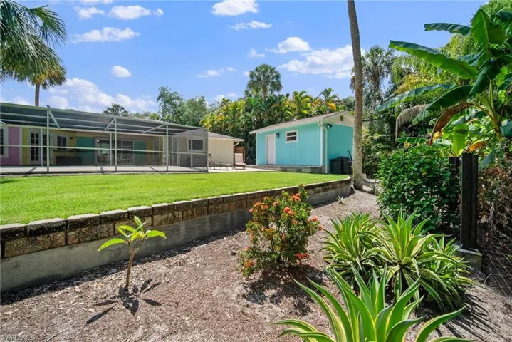 View of yard with a patio and a lanai