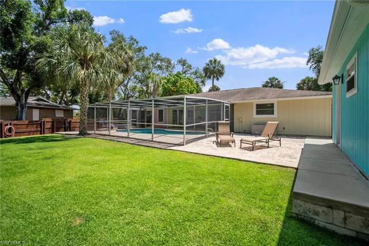 View of yard with a patio area and a lanai