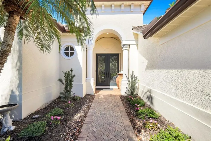 Entrance to property with french doors and stucco siding