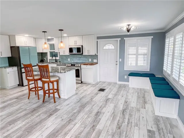 Open concept living, dining and kitchen